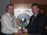 Niall Kearney presents Damien Mc Gaughey North Antrim Junior Hurling League Trophy